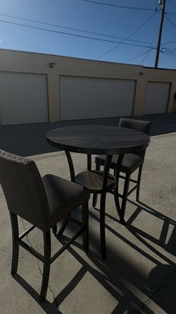 Round Table with Two Chairs