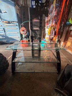 Tv stand with 3 glass shelves…..
