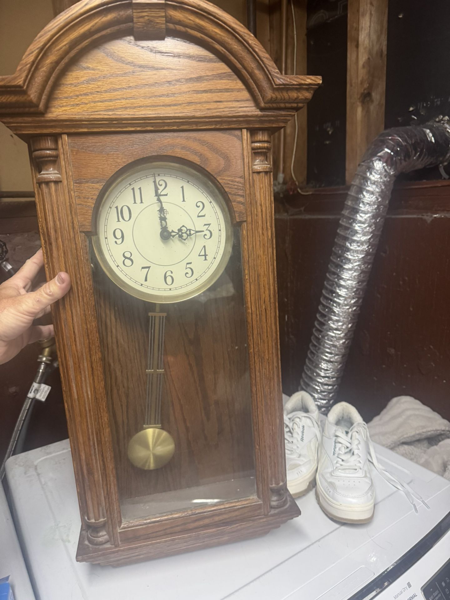 Clocks One Is A Grandfather Wall Clock And The Other Is A Collectible Disney Wall Clock 
