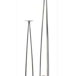 Modern Fiesta and Co. stainless steel with rock accent candle holders. Tallest candle holder measures approximately 40.5in x 4.2in x 4in.
