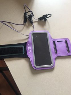 Headphones with arm phone holder