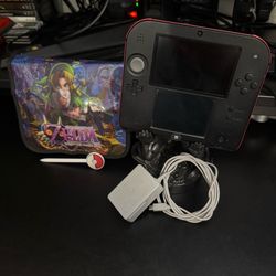 Nintendo 2DS with charger, Zelda case and Pokemon stylus