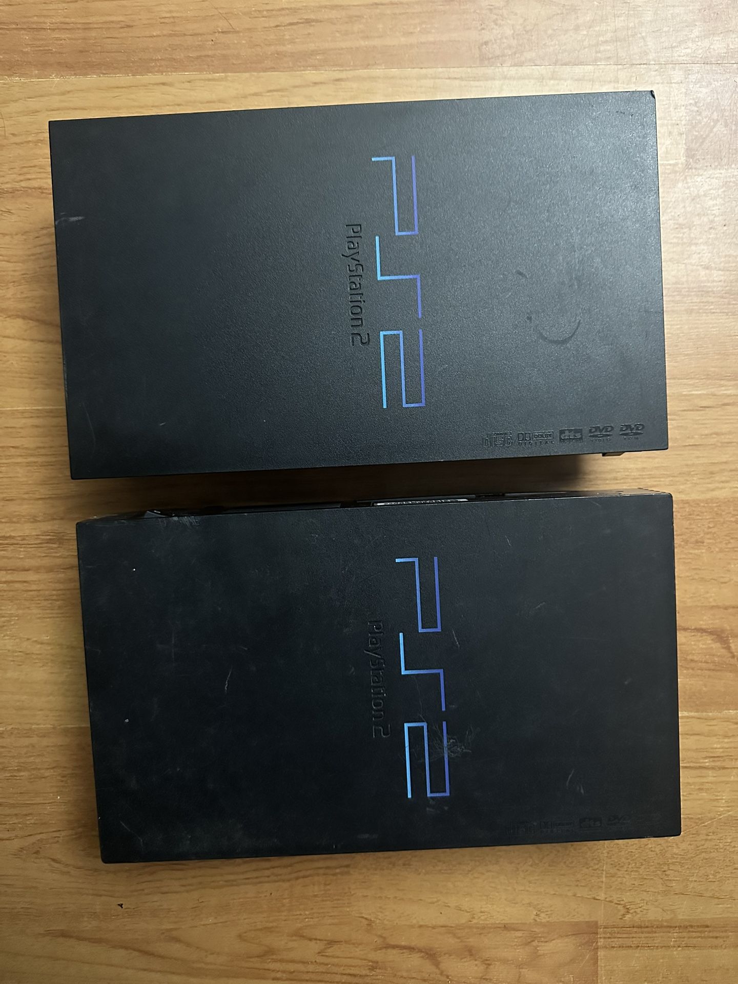 2 PS2 Consoles(FOR PARTS OR REPAIR)