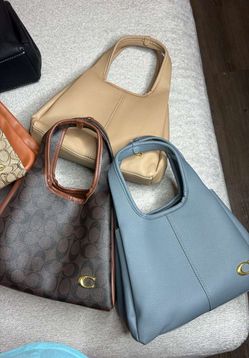 Carteras coach mediana