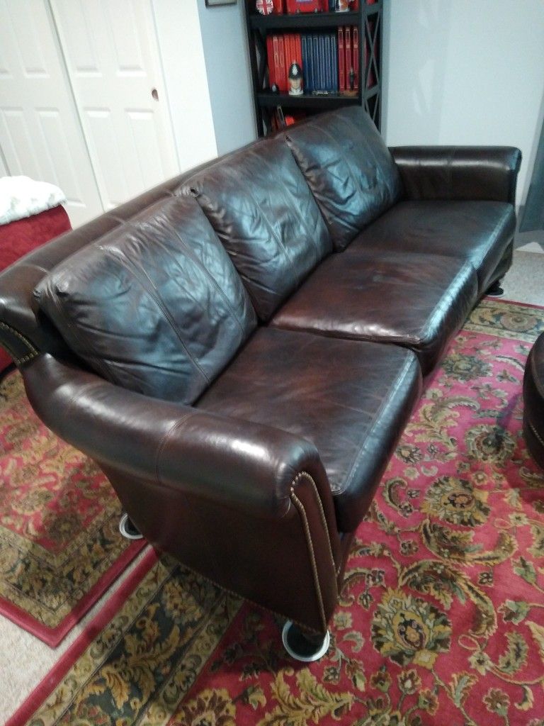 Brown Leather Sofa with matching arm chair and footstall
