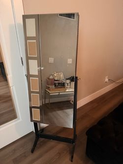 Standing mirror with storage