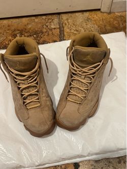 Premium tan suede high-top design with padded collar for ankle support. Cushioned midsole delivers responsive comfort for all-day wear. Durable rubber