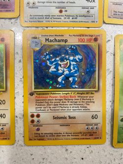 Rare Pokemon cards, including 1st edition Machamp, and promo dragonite