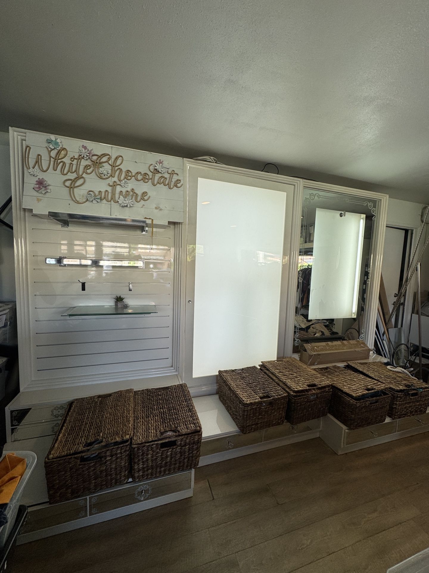 Office salon lit up display white lacquer wall unit drawers slat wall custom made glass hanging rod