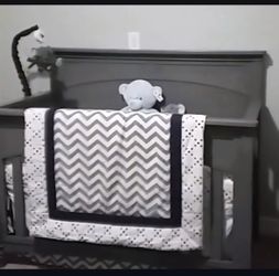 Grey wooden crib