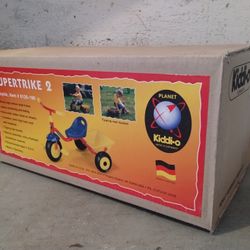 Kiddi-O Supertrike 2 tricycle, Graco portable playard, Liberty Carpet Co. Inc. ABC's play rug