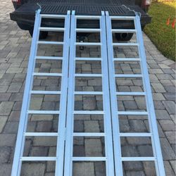 Tri -fold aluminum loading ramp, Used once for loading ride on mower, like new local pick up Price is Firm!