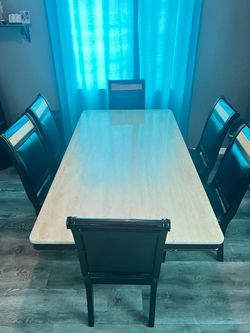 Marble table, 6 chairs, and a mirror