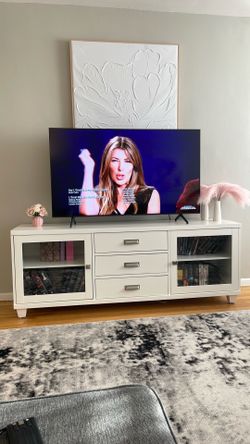 70 inch TV console with three drawers used but in good condition