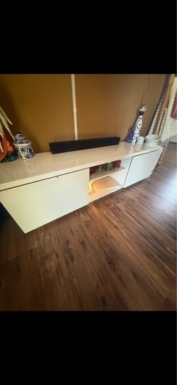 White TV table for a big TV very nice and sturdy asking 100