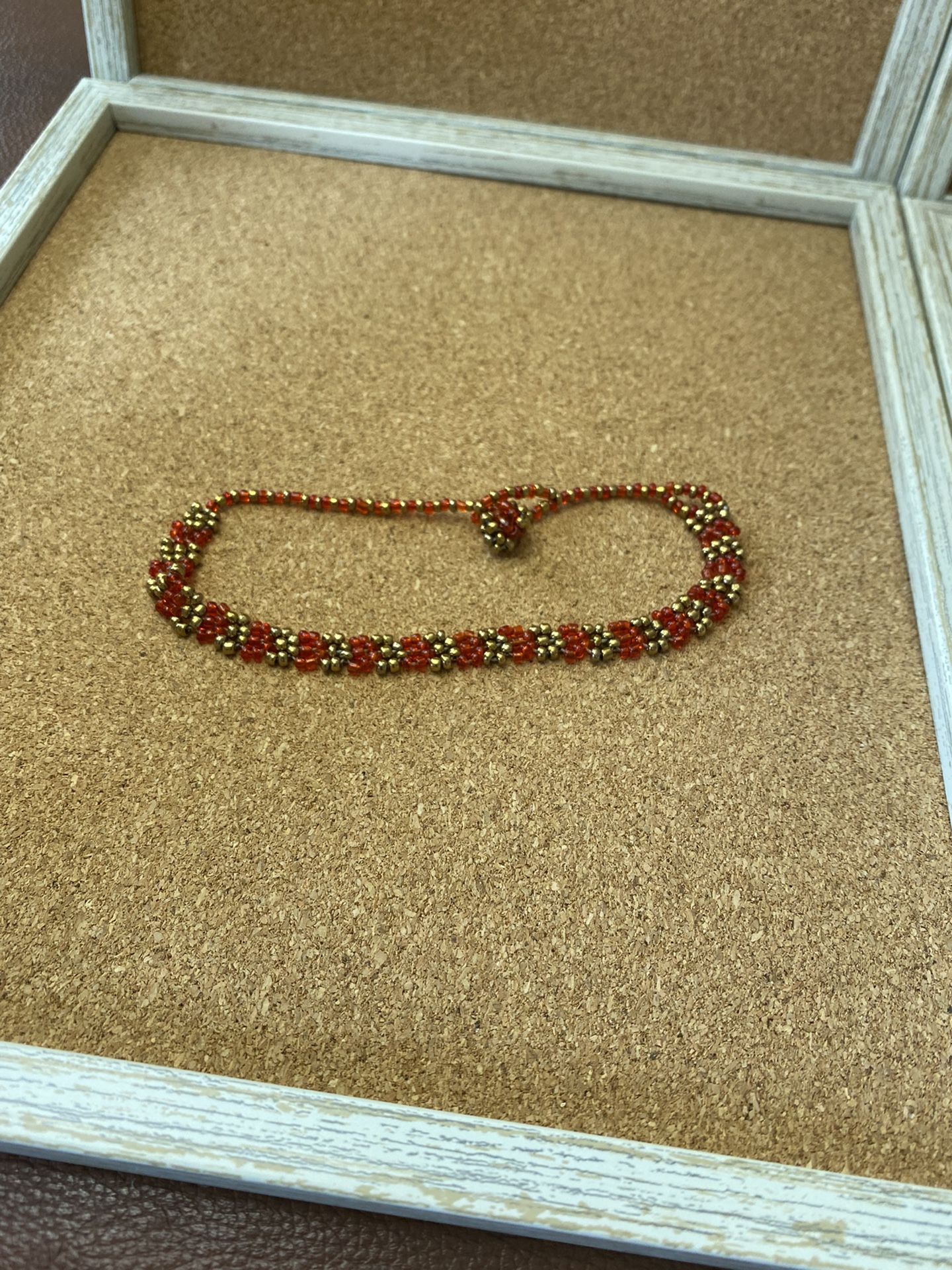 Hand crafted seed bead red and golden anklet to be worn on the ankle