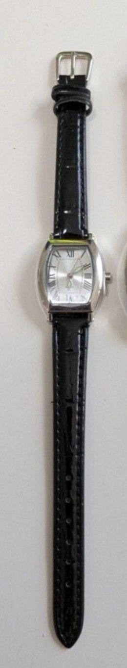 New stylish watch with black leather strap and silver dials.
It still has the protective cover on the face and the stem.