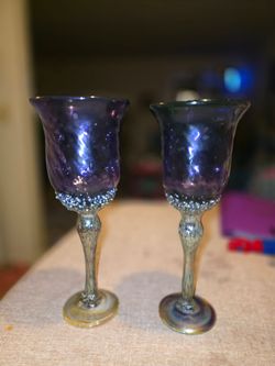 John Barber set of 2 handblown glass purple wine goblets. Each piece is unique with an aquatic-themed design and applied iridescent metallic drip elem