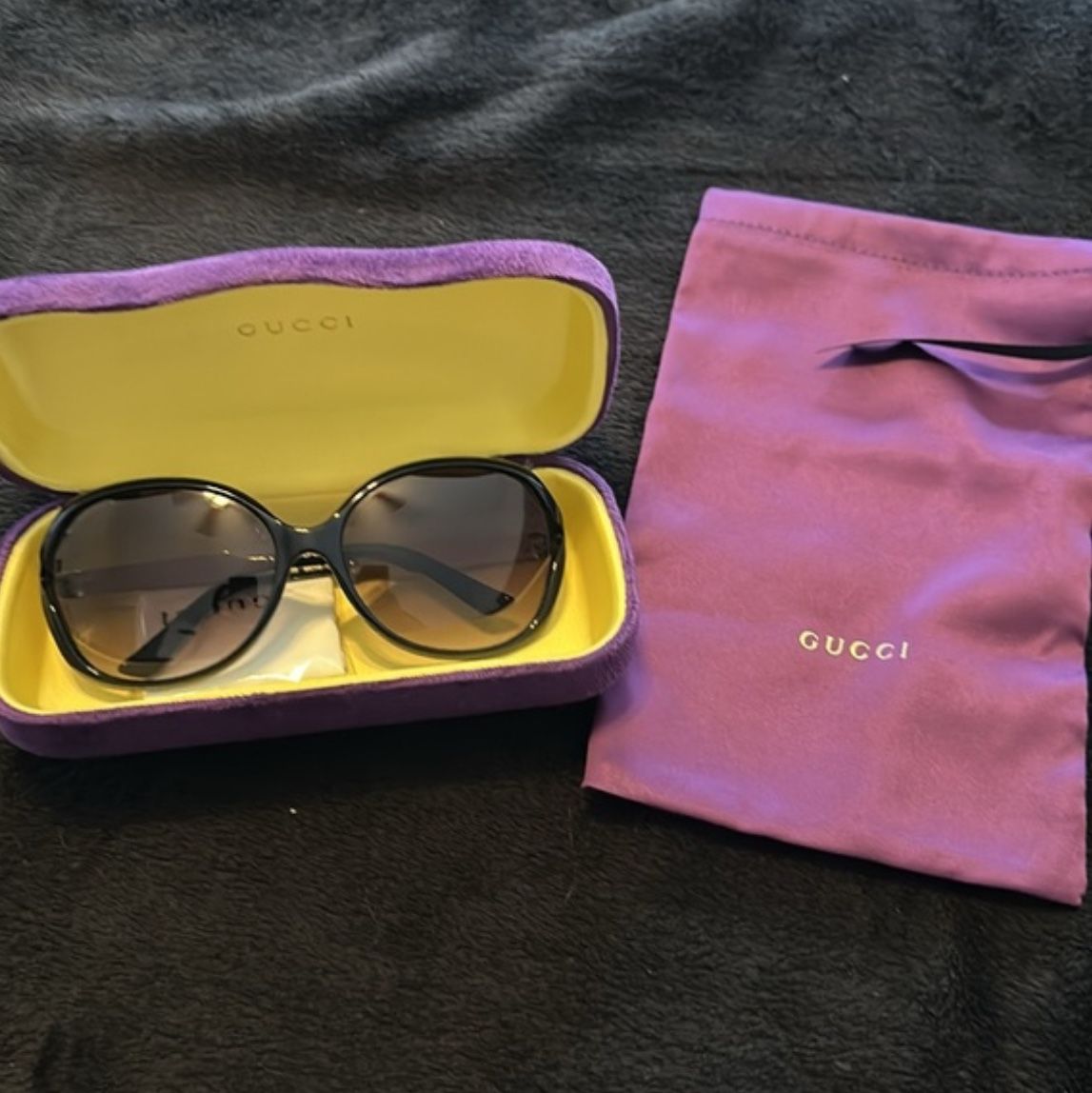 Gucci, Grady, and black and gold sunglasses