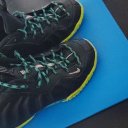 Nike Little Posite One sneakers in a black and volt colorway.