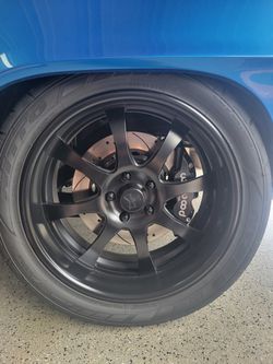 Two Triumph Rims with Tires