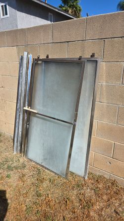 Shower doors w/ track amd hardware.