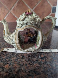 Decorative teapot shaped tabletop figurine