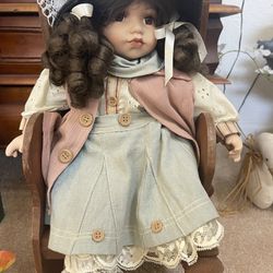 Collectible porcelain sitting Doll With chair