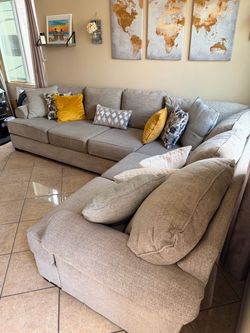 Large and beautiful beige sectional couch from Jerome’s