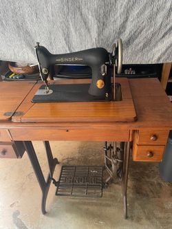 Singer Model 66-14 vintage straight-stitch sewing machine with manual and accessories