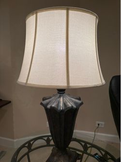 2 black iron lamps