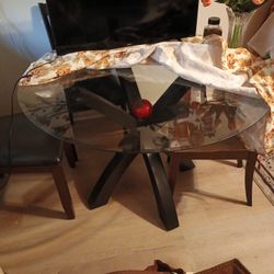 glass round table fits 4/6 with 4 black chairs