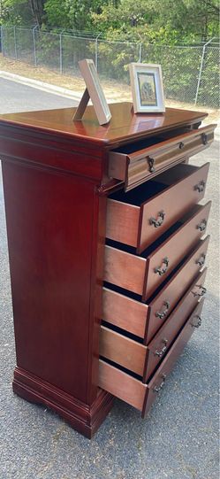 Definitely available. Solid Wood tall chest with big drawers. Drawers sliding smoothly