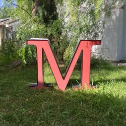 Sign marquee letter “M”