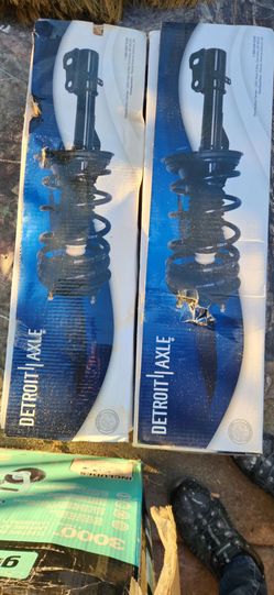 Brand new -  strut w/ coil spring