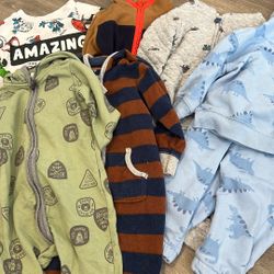 1 12 months onesies, 1 9 month onesie, 2 12 month sweatshirt and sweat pant set, 1 12 month coat, and 1 12 month crew