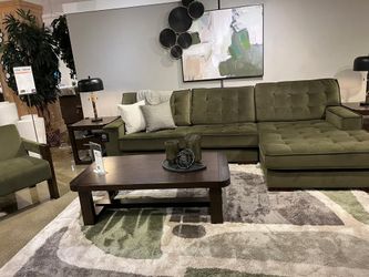Large Sleek sectional in rich olive green features uptown style & comfort