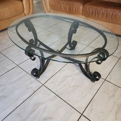 Oval glass and black iron coffee  table
