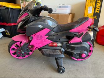 Pink bmw electric motorcycle. Charger not included