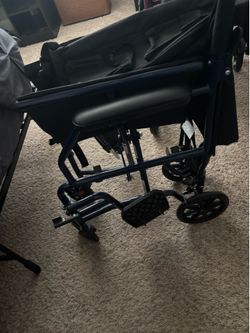 Wheelchair/oxygen tank holder