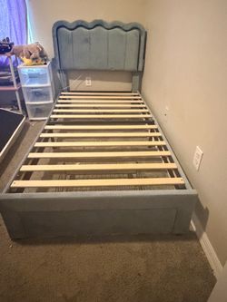 Blue twin bed with led light on the headboard