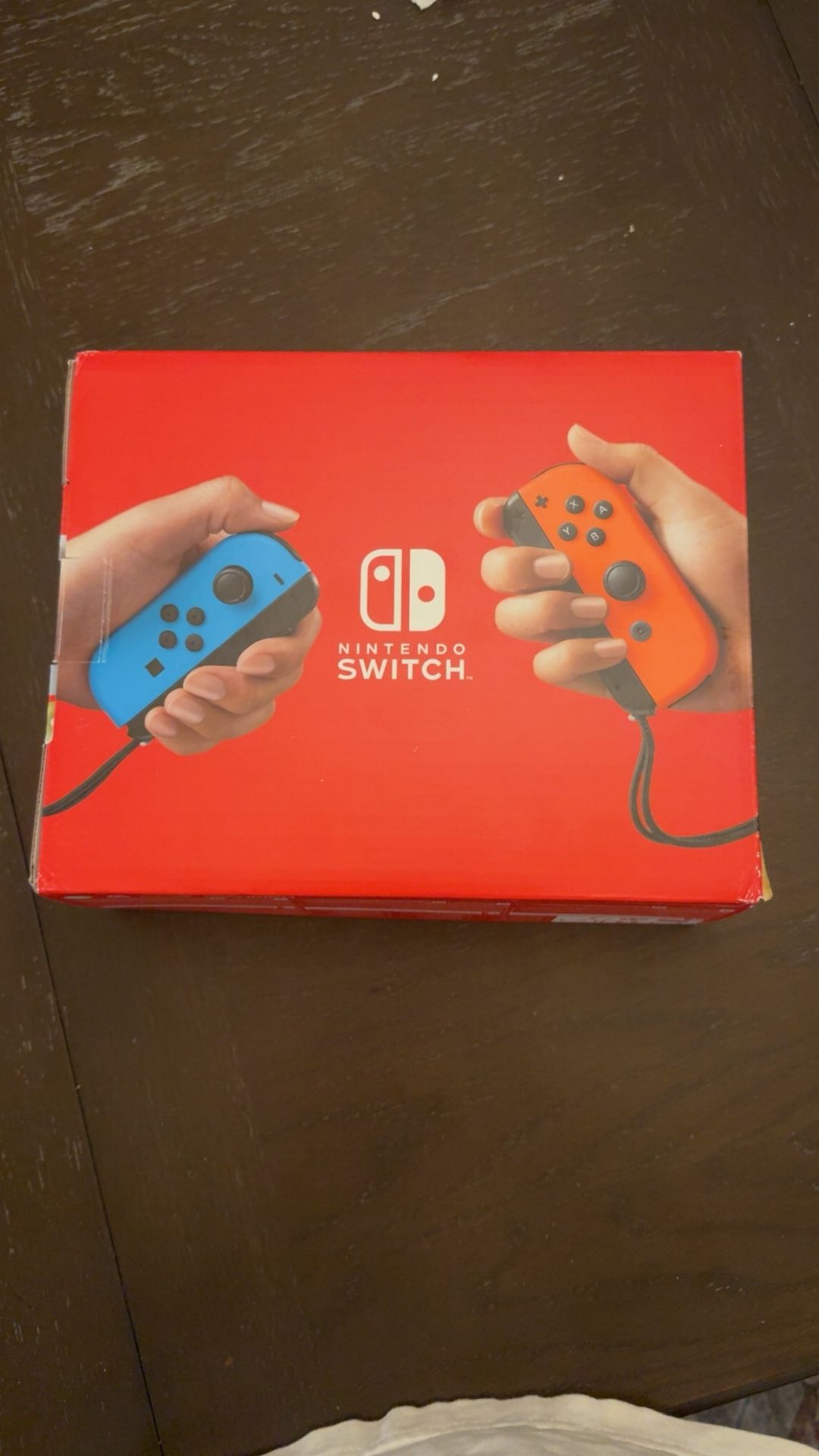 Nintendo Switch With Blue And Red Controllers