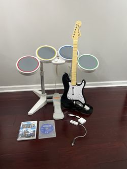 Nintendo Wii Rock band 1 and 2 ( wired drums, guitar, dongel, sticks, pedal and 2 games) TESTED