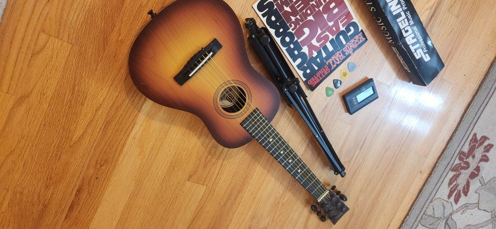 Small Guitar,Tuner, Music Stand, Book,Pics Right Hand