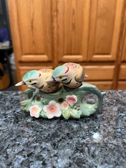 Vintage Two Birds Sitting On A Branch Pair of Salt And Pepper Shakers.  Size approximately 3 1/2 inches tall.  Preowned never used.  One bird has mino