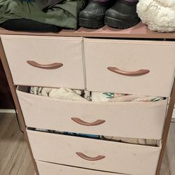 Pink cloth and metal dresser