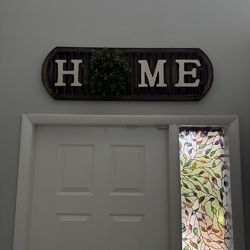 “Home” wooden entryway sign