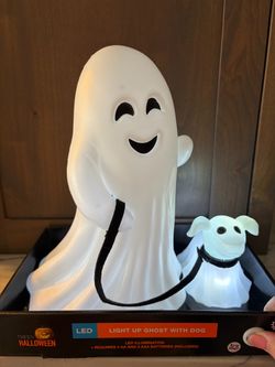 Illuminated white plastic ghost figure walking a small ghost dog. This Halloween decoration has LED lights. New in box