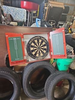 DART BOARD- GOOD SHAPE NEVER USED