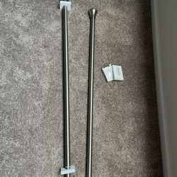new 2 tension shower rods  to hold curtains 